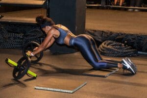 A woman working out in a dark gym