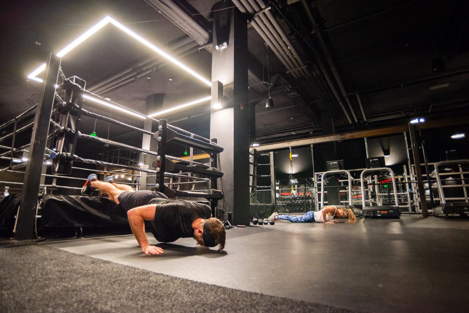 Two people working out and doing push ups